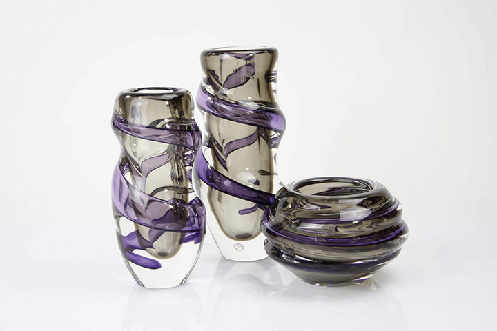 Smoked crystal vases with a spiralling amethyst glass trail